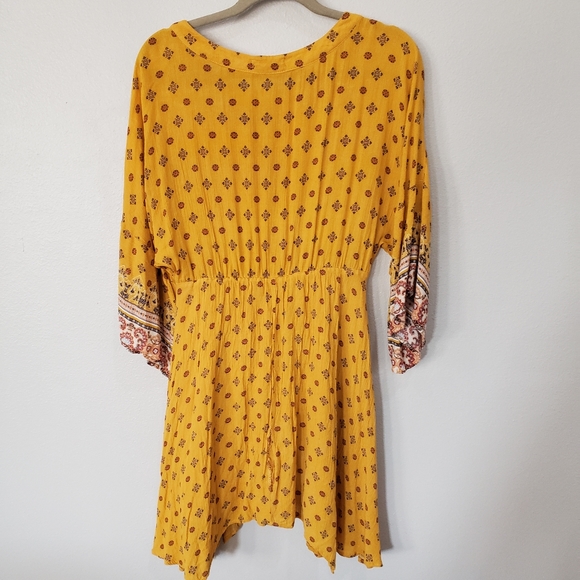 Coco+Jaimeson Large Boho Style Dress with Bell Sleeves and a Handkerchief Hem - Picture 6 of 6